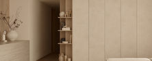 Light Resort Japandi living room joinery with full height beige storage cabinets and corner display shelving for decorative vases.