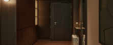 Dark Japandi hallway design with concealed dark wood door panels warm ceiling spotlights and soft floor glow.