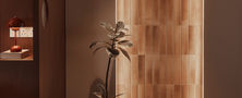 Close view of backlit timber arched doorway feature wall creating a warm atmosphere in living room.