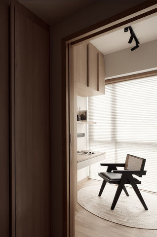 Contemporary calm study interior featuring neutral palette, simple furniture, and Scandinavian-inspired minimalism