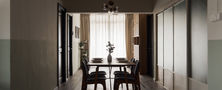 Retro modern dining area featuring dark wooden dining table set, fluted sliding glass doors, and sage green two-tone walls.