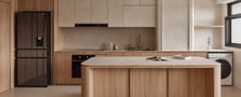 Bright modern kitchen design featuring two-tone oak and cream cabinetry, curved island peninsula, integrated appliances, and open shelving.
