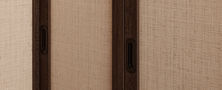 Close up architectural detail showing textured neutral wall paneling framed by dark wood timber trims.