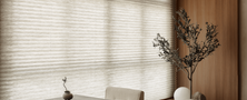 Modern Ryokan tea drinking corner with low floor seating, tea table, potted bonsai, and shoji window blinds.