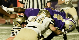 Tyon Coe dives for yardage vs. West Forsyth