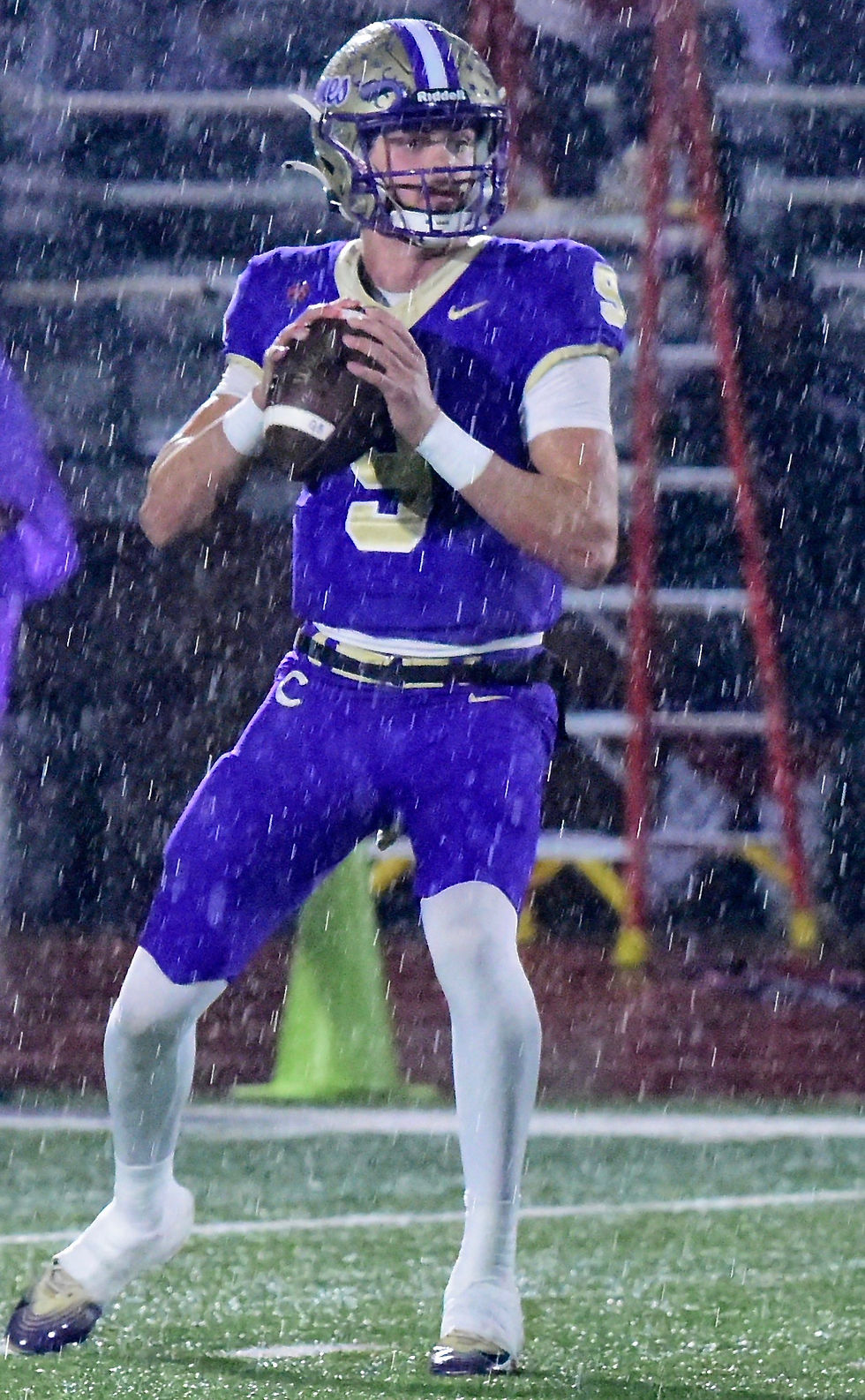 With rain falling, Canes' QB Nate Russell looks downfield vs. Warner Robins on Nov. 21. RANDY PARKER / DTN