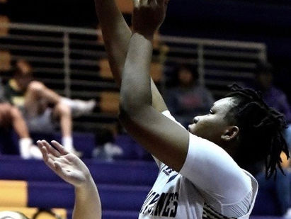 Lady Canes win tourney opener in OT