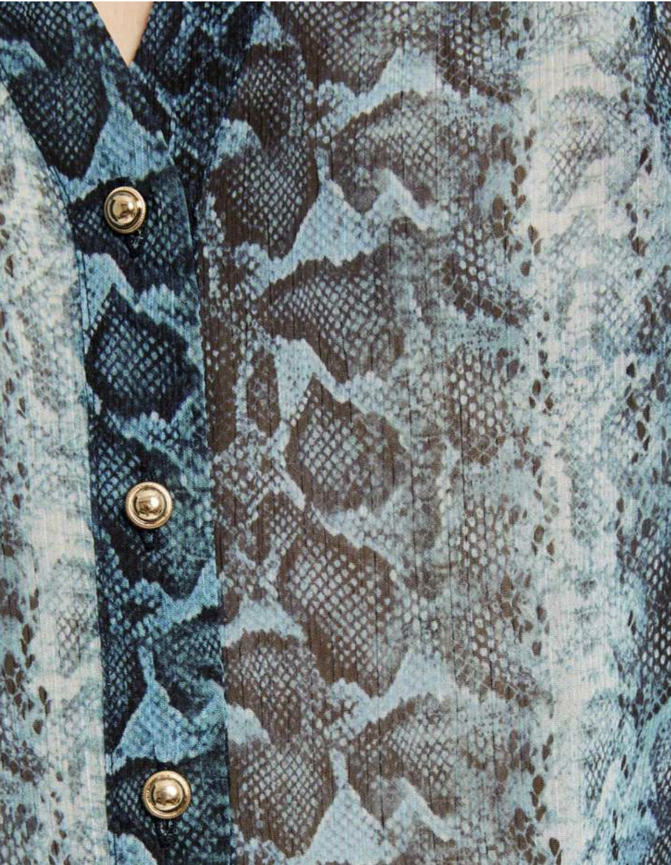 Miniatura: Vestido azul de manga longa com um detalhe de laço, uma escolha estilosa para qualquer evento.