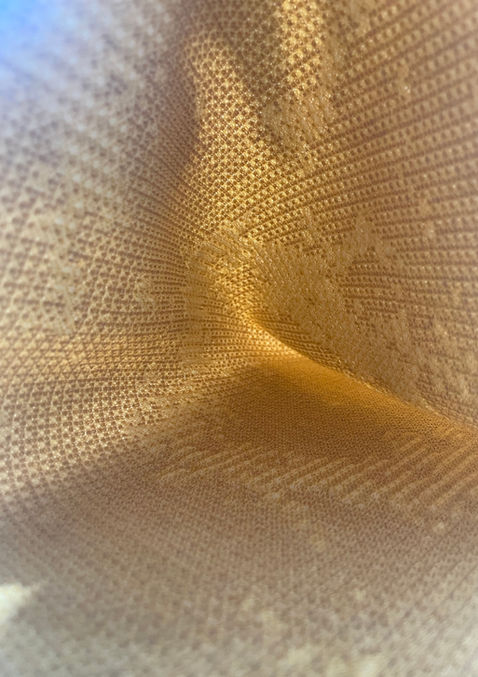 Seamless compression mesh interior layer developed for body-mapping applications