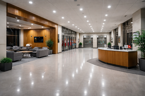 Clean government office lobby with reception desk and polished floors under evening lighting, representing institutional cleaning services in Winnipeg.