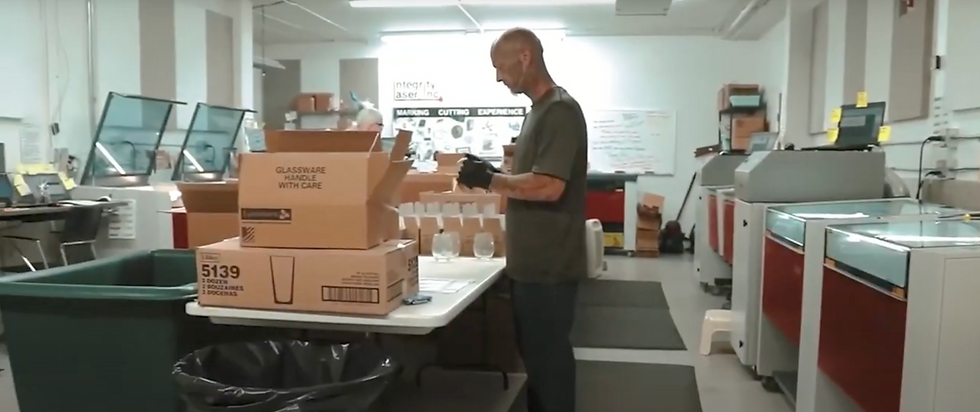 Production facility running multiple Trotec Speedy laser engravers.