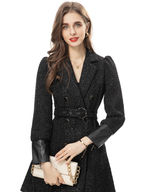 Woman in black coat, holding clutch; UK Fashion Boutique, KMCee Style.