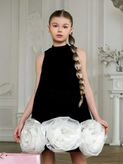 Girl in black dress with white floral details, KMCee Style.