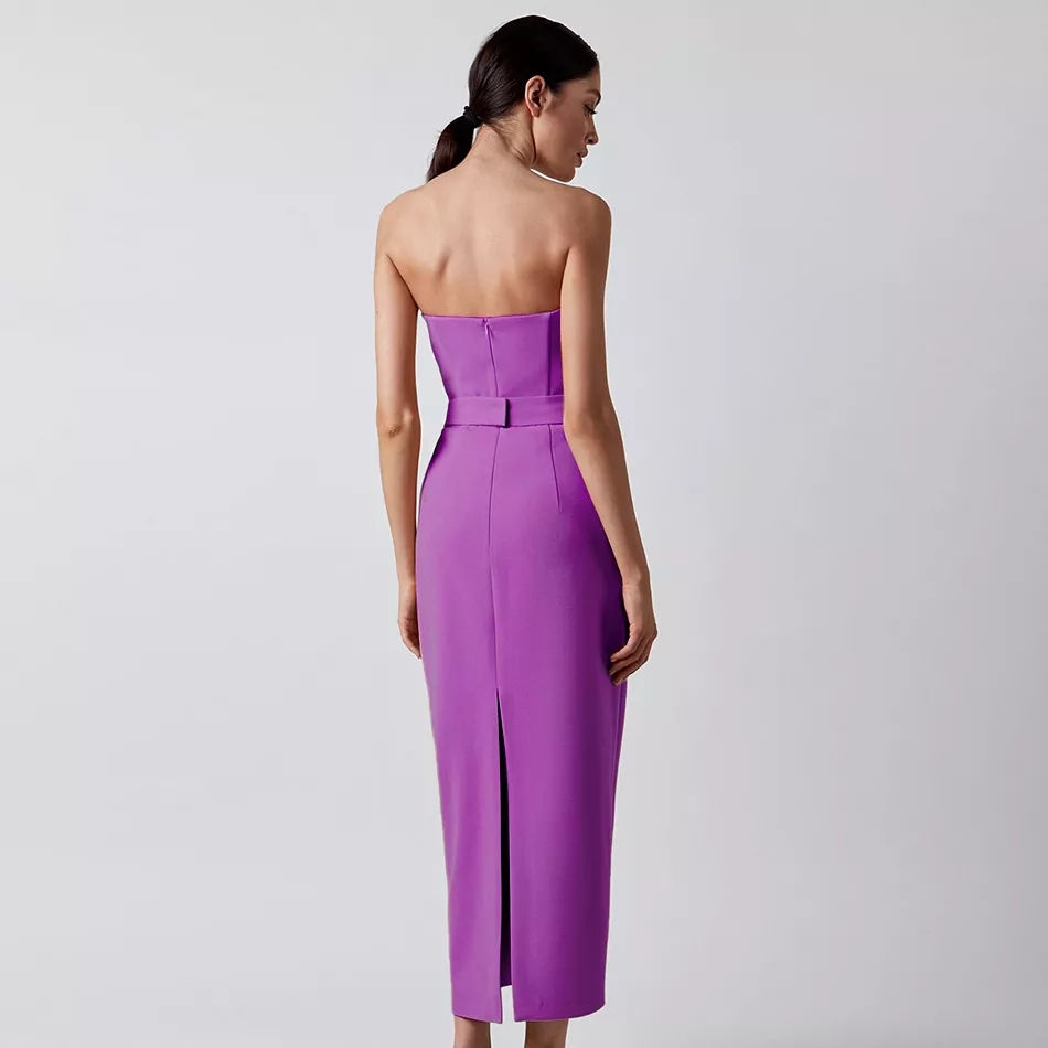 Miniatură: Woman in purple midi dress, back view