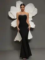 Woman in elegant black strapless gown
