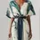 Sīktēls: Woman's teal and white abstract print belted dress