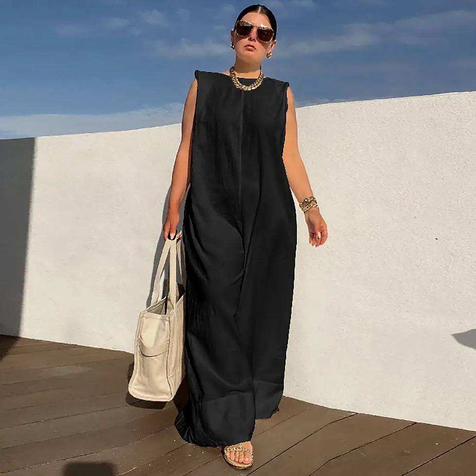 Woman in stylish black maxi dress