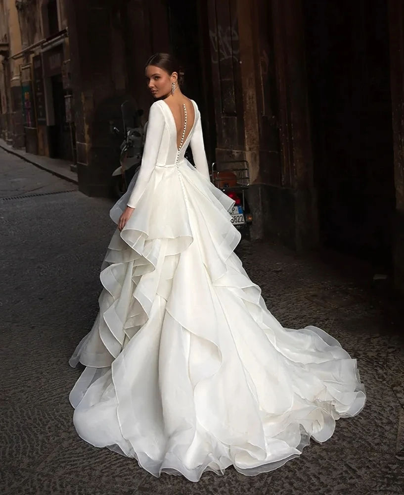 Elegant layered tulle wedding gown, long sleeves, open back