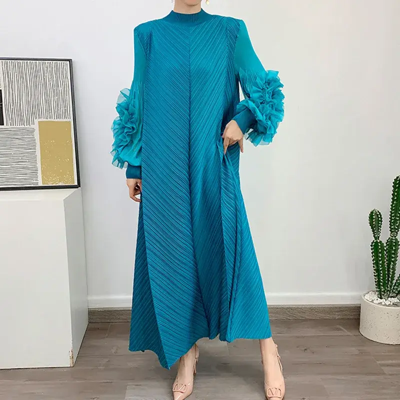 Teal pleated maxi dress with ruffled cuffs