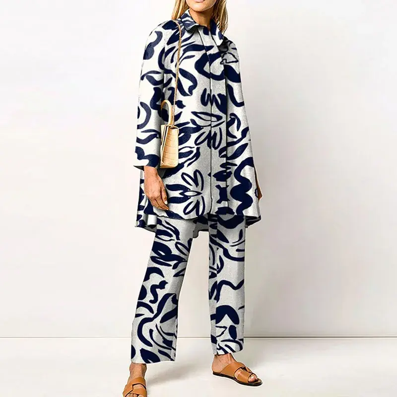 Miniatura: Woman in stylish abstract print pantsuit