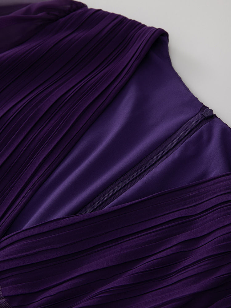 Close-up of pleated purple dress back detail