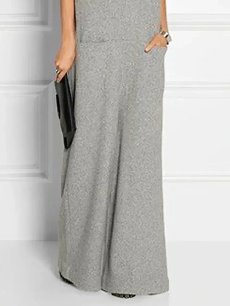 Thumbnail: Woman wearing stylish gray high-waist wide-leg trousers