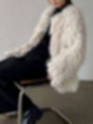 Cream-colored fluffy coat