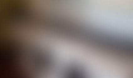 A sober living home featuring 4 washer and dryer machines in a wash room.