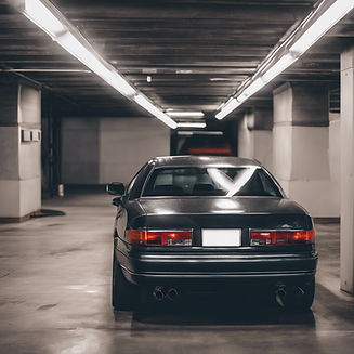 a nice, modern car after being detailed, parked in a rooftop parking garage.jpg