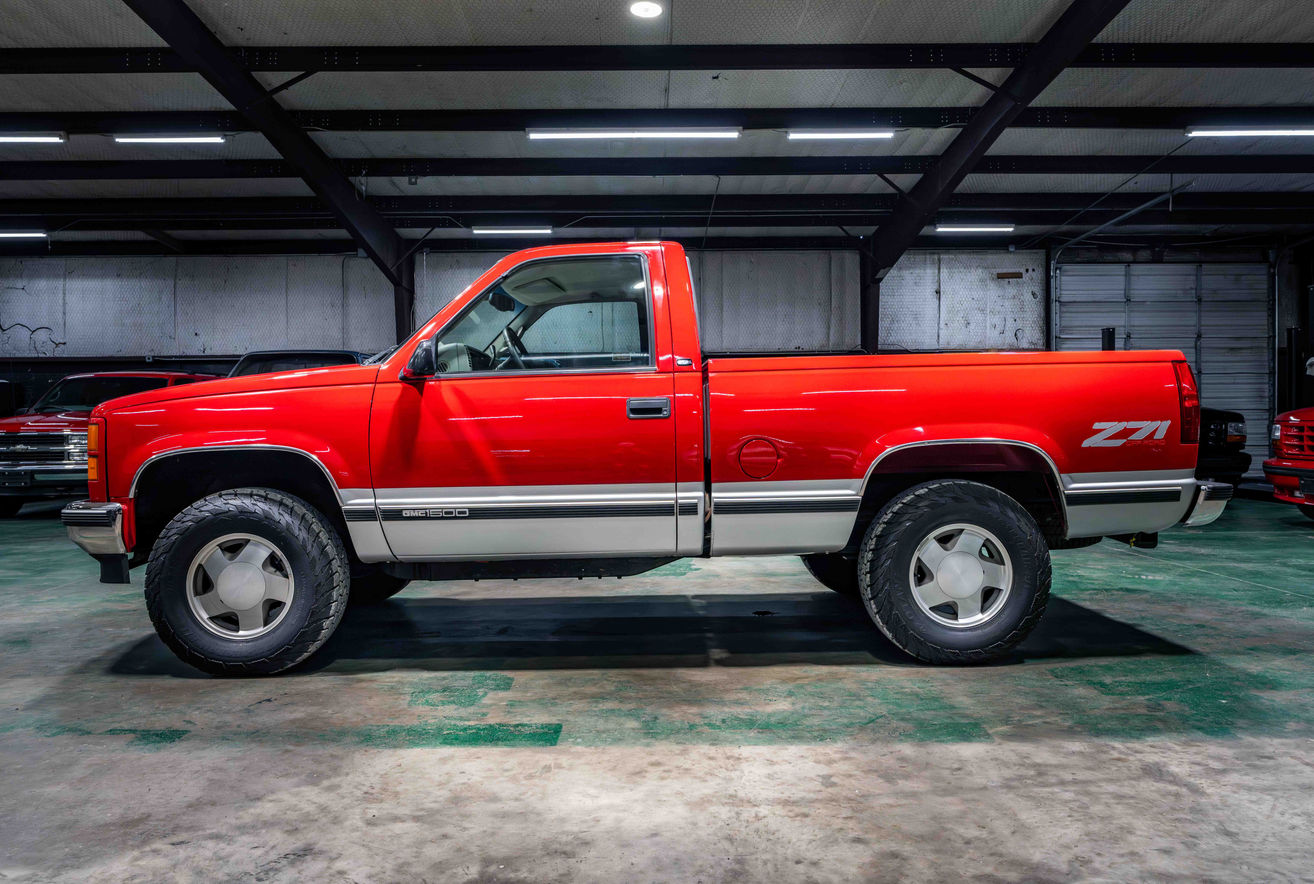 1997 GMC K1500 finished in FireRed and QuickSilver two-tone with factory fuel-injected 350 and automatic transmission