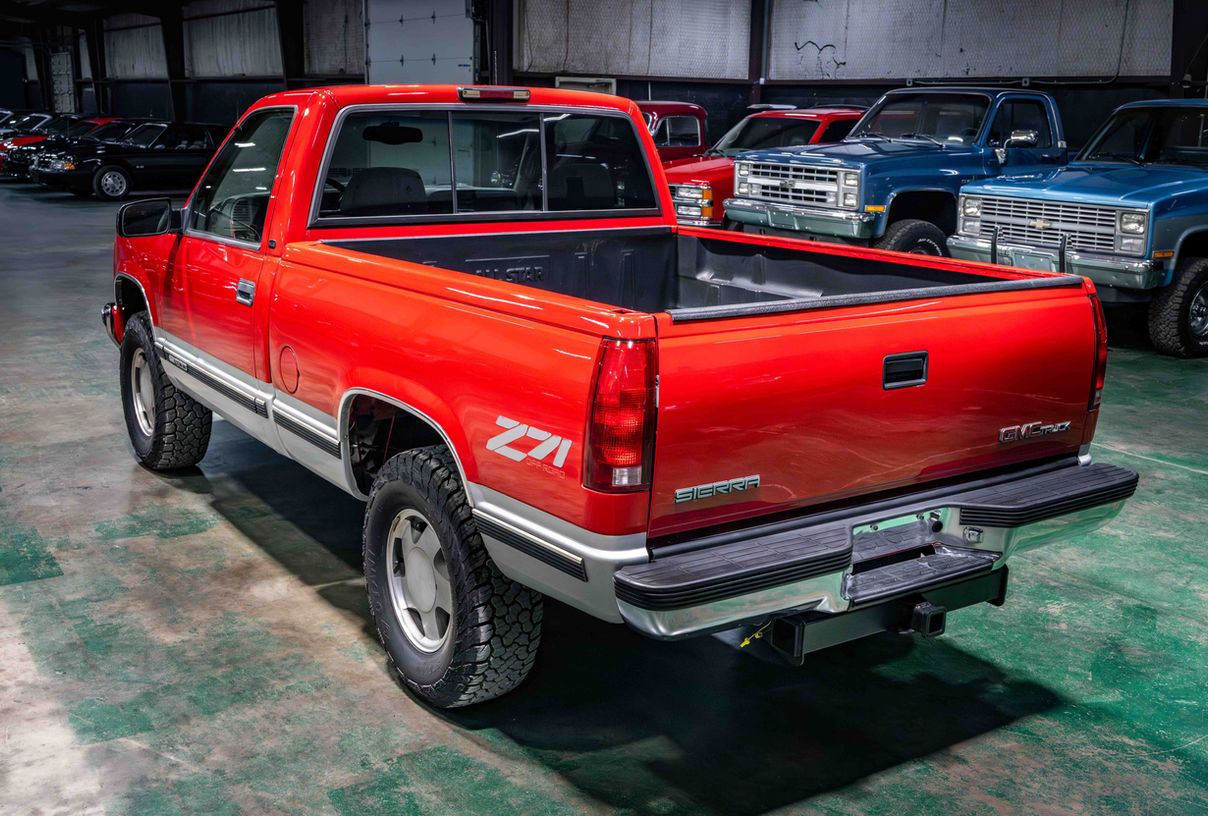 1997 GMC K1500 finished in FireRed and QuickSilver two-tone with factory fuel-injected 350 and automatic transmission