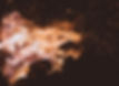 A fire igniting a strong flame against a dark background.