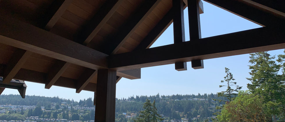 Stained Complex Fir Timber work. New construction home. Front entry.
