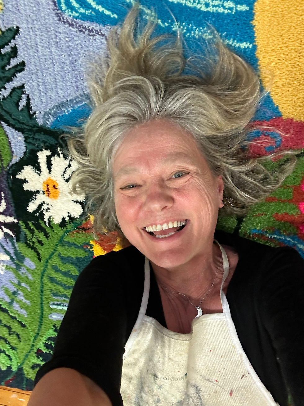 Thumbnail: Holly rolling on tufted rug of fox, moon and fauna along a river by Canadian Artist Holly Friesen
