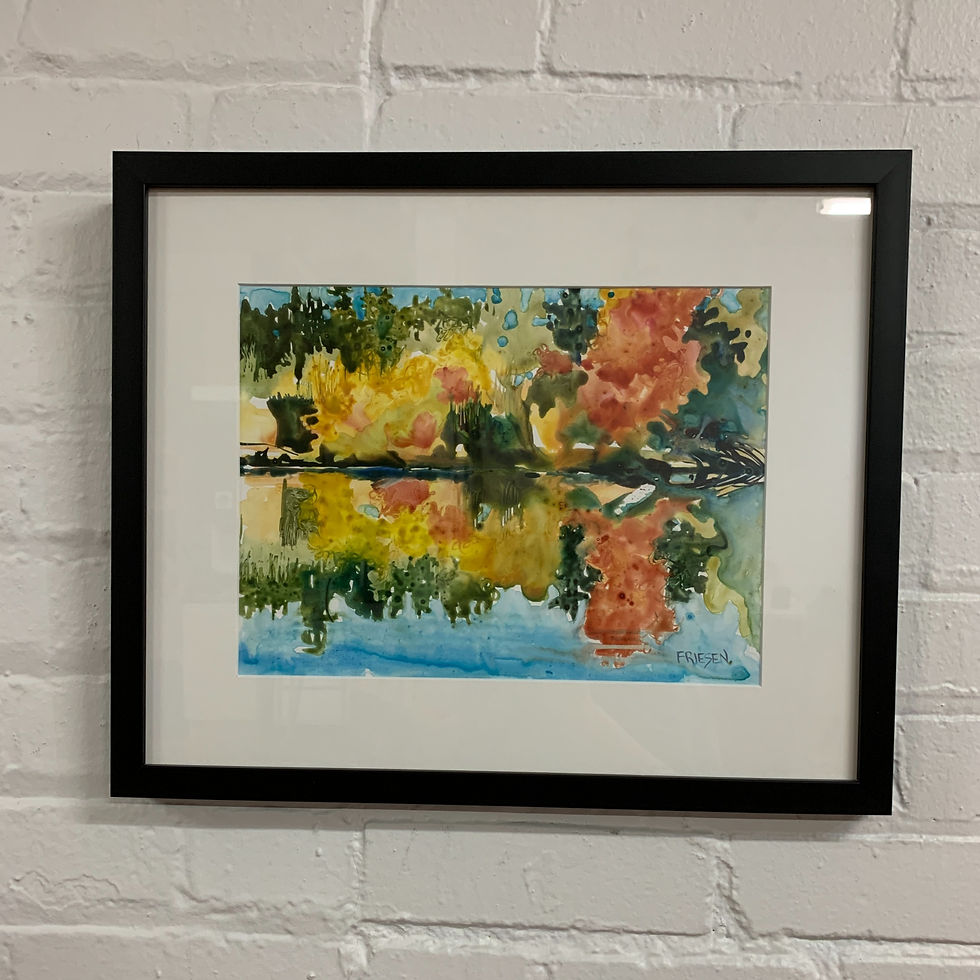 watercolor painting of warm autumn colors reflected into a river framed under glass