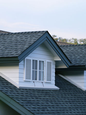 dark-gray-roof-white-shutters