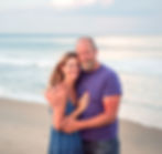 A married couple on a beach.