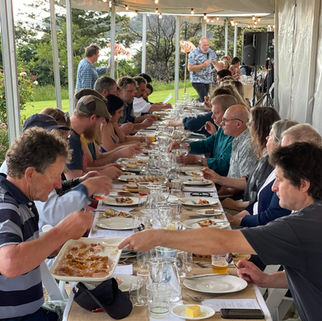 whelk-om dinner guests enjoying fresh local seafood
