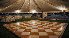 tan and white dance floor under a tent (1).jpg