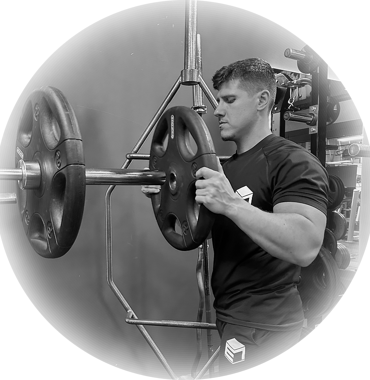 Enis Mesutllari loading up a barbell for a squat