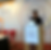 woman standing at a podium