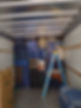 A Moving truck packed with houshold items. Edge to edge.