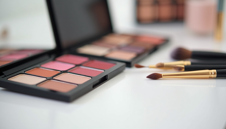 Close-up view of makeup tools and color palettes arranged neatly for a personalized makeup session