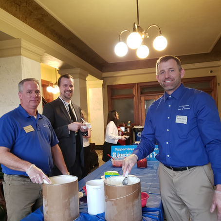 South Dakota Association of Towns and Townships serving SDSU ice cream sundaes at the capital.