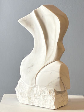 Hand carved, one a kind white Carrara marble sculpture of an abstract women’s torso. Table top