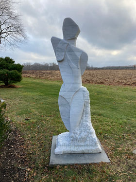 Carved by American contemporary sculptor Paul Maus, this sculpture is an abstract white danby marble figurative sculpture of a women’s torso. Exterior
