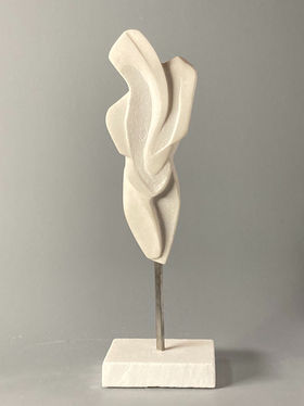 Hand carved, one a kind white danby marble sculpture of an abstract women’s torso mounted on a stainless rod. Table top.