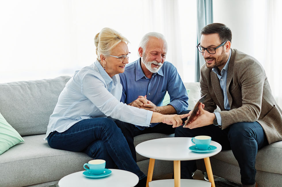 Senior couple having a meeting with an agent, businessman, salesperson or doctor in his of