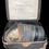 Thumbnail: WW2 civilian gas mask inTala (Taylor Law & Co. Ltd) tin case.
