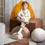 Thumbnail: Coussin rouleau en velours marron